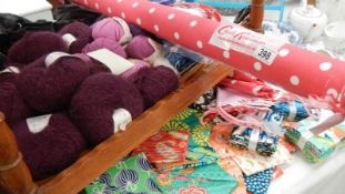 A good lot of knitting wool and fabric including a part roll of Kath Kidson