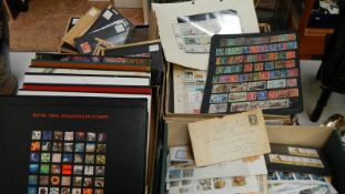 A collection of stamps including GB and world together with empty Royal Mail year books