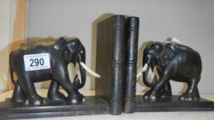A pair of ebony elephant book ends