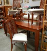 A good quality modern dining table and 8 chairs