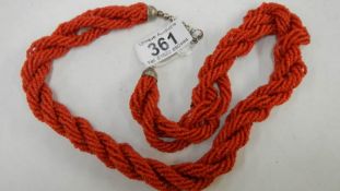 A rope twist coral necklace