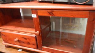 A stained pine TV stand