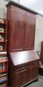 A mahogany bureau bookcase