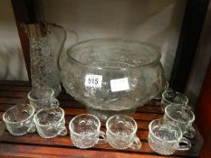 A punch bowl and glasses