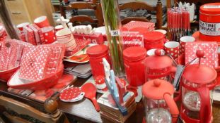 A very large lot of red and white kitchen and tableware including cafetiere's,