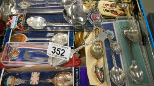A quantity of collector's spoons including some silver
