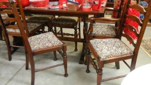 An oak refectory table and 6 chairs