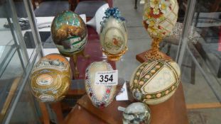 A collection of decorative eggs including hand painted