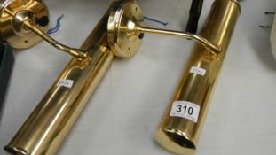 A pair of brass picture lights