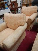 A pair of arm chairs