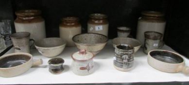 A shelf of David Leach studio pottery etc.