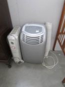 An air conditioning unit and a De Longhi dragon 3 electric heater