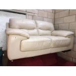 A 2 seater cream leather settee