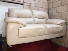 A 2 seater cream leather settee