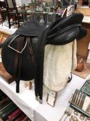 A Teqnic horse saddle with stirrups, girdle, girth, bridle,