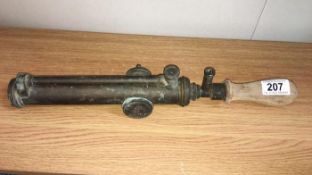 An unusual brass garden sprayer