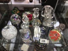 A quantity of glass paperweights