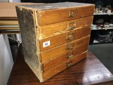 A 6 drawer oak fronted stationary cabinet