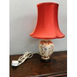 An oriental base table lamp with shade