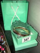 A tri-colour metal bracelet marked Tiffany & Co.