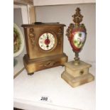 A mantel clock & 1 other item