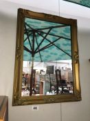 A gilt framed mirror