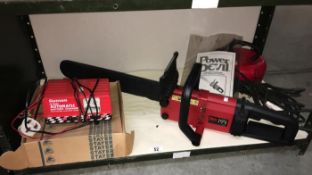 A Power Devil electric chainsaw & a Gunson 12V automatic battery charger