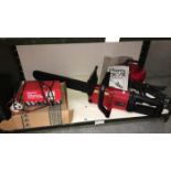 A Power Devil electric chainsaw & a Gunson 12V automatic battery charger