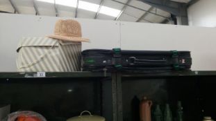 A hat with hat box & a suitcase