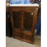 A glazed fronted cabinet