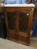 A glazed fronted cabinet