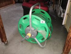 A long garden hose on reel