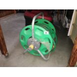 A long garden hose on reel