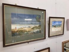 A pair of framed and glazed beach scenes