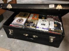 A suitcase with a quantity of CD's
