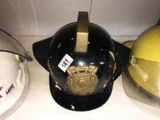 A Dutch firemans helmet with brass fittings & leather lining