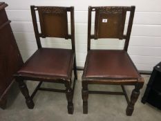 Two 1920's dining chairs with leather seats