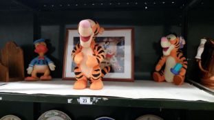 A collection of Disney items including print & toys