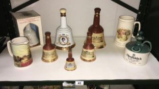 A quantity of Bells whisky decanters & Wade jug etc.