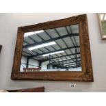 A gilt framed mirror