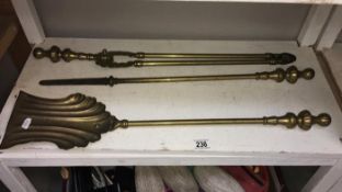 A brass fire poker & shovel etc.