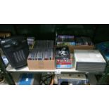 A collection of CD's & 2 small electric heaters