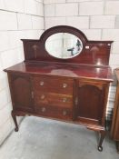 A mahogany sideboard with mirror