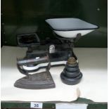 A set of scales with weights & an old iron