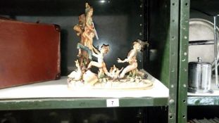 A Capodimonte figural group of man chasing boys up a tree