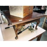 A low mahogany occasional table