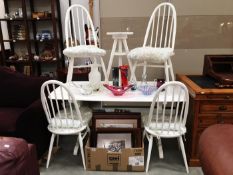 A painted Ercol style dining table and 4 chairs with painted stool