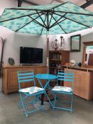 A blue metal patio set with parasol & extra base