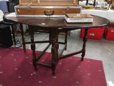 A drop leaf oval table