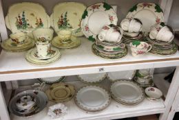 A quantity of miscellaneous teaware including Limoges (2 shelves)